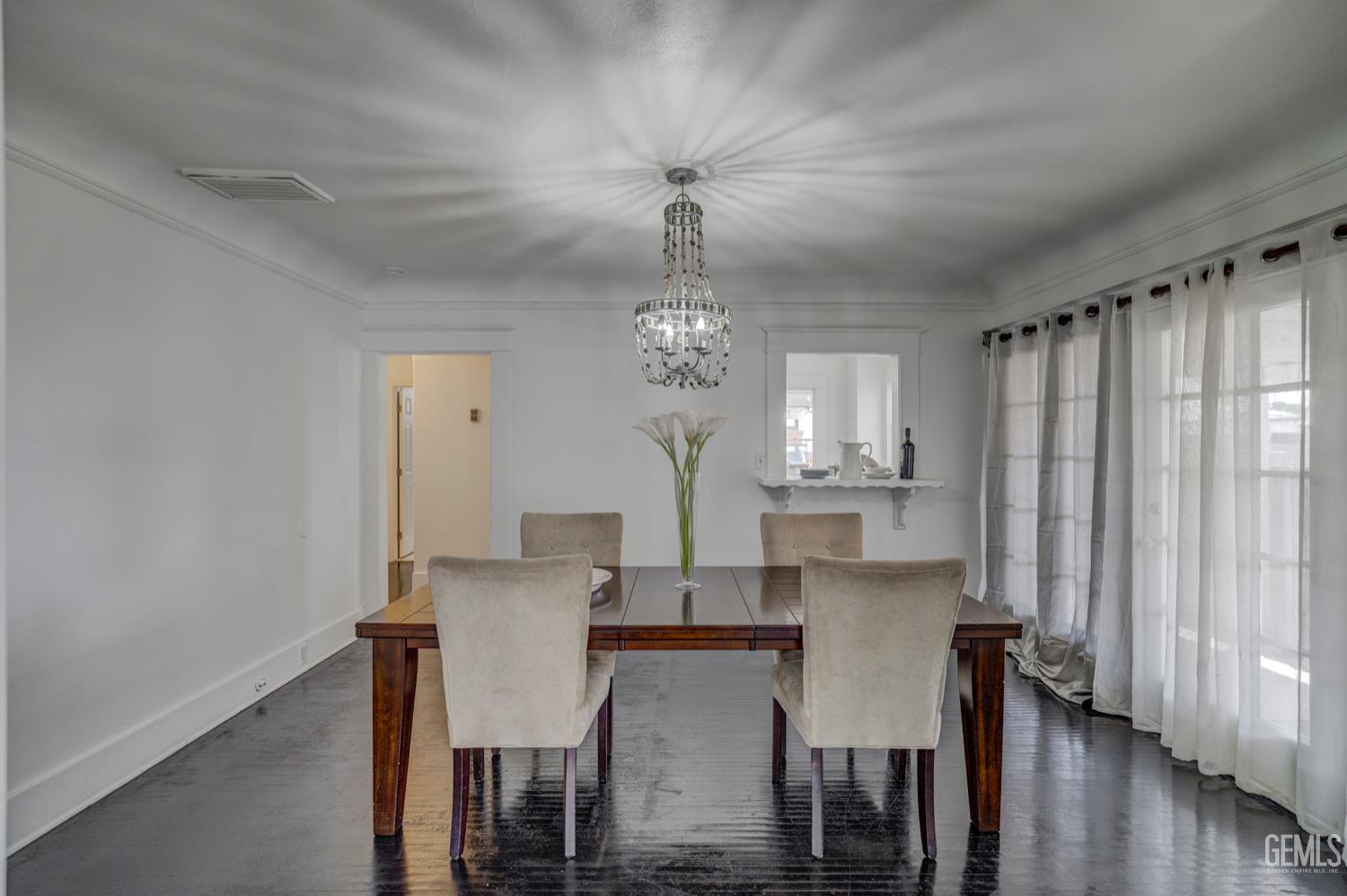 Undisclosed Address Bakersfield, CA 93304 - Photo 10 of 30 a view of a dining room with furniture and wooden floor