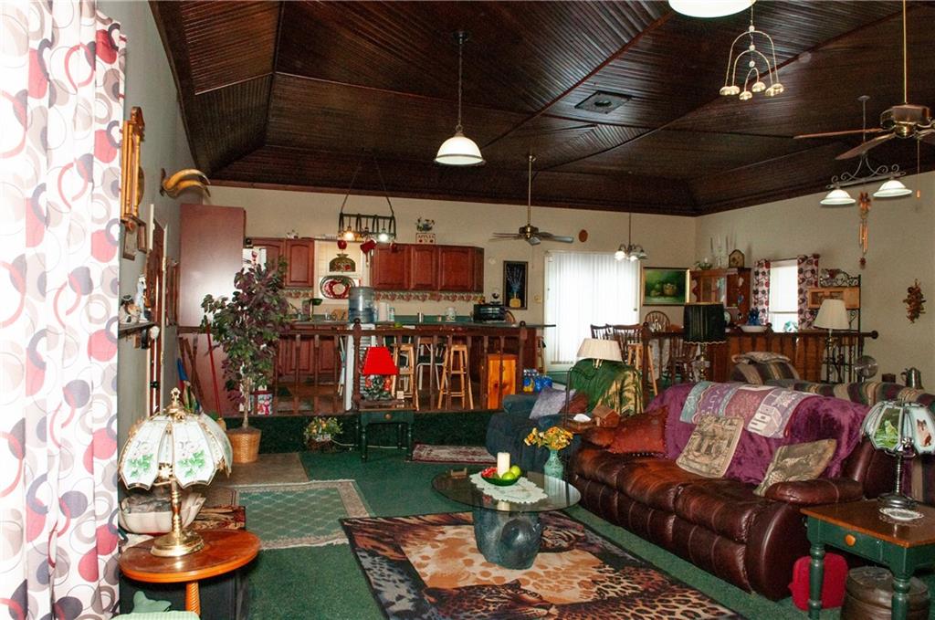 2271 Garards Fort Road Waynesburg, PA 15370 - Photo 11 of 42 a living room filled with lots of furniture and a chandelier