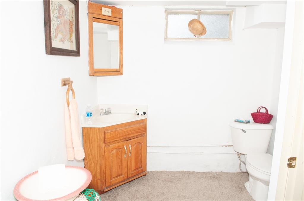 2271 Garards Fort Road Waynesburg, PA 15370 - Photo 17 of 42 a bathroom with a sink toilet and vanity