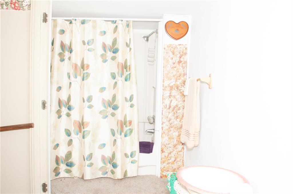 2271 Garards Fort Road Waynesburg, PA 15370 - Photo 18 of 42 a bathroom with a shower curtain