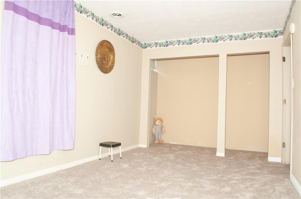 2271 Garards Fort Road Waynesburg, PA 15370 - Photo 22 of 42 a view of a room with wooden floor and windows