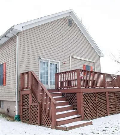 a view of a house with wooden deck