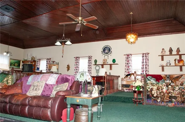 a living room filled with furniture and a flat screen tv
