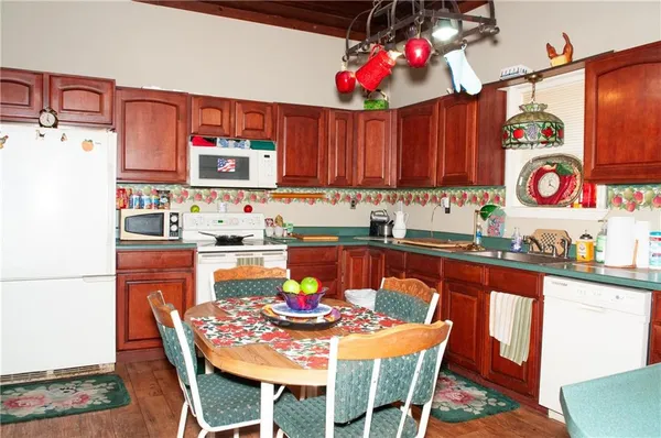 a dining table and chairs in a kitchen