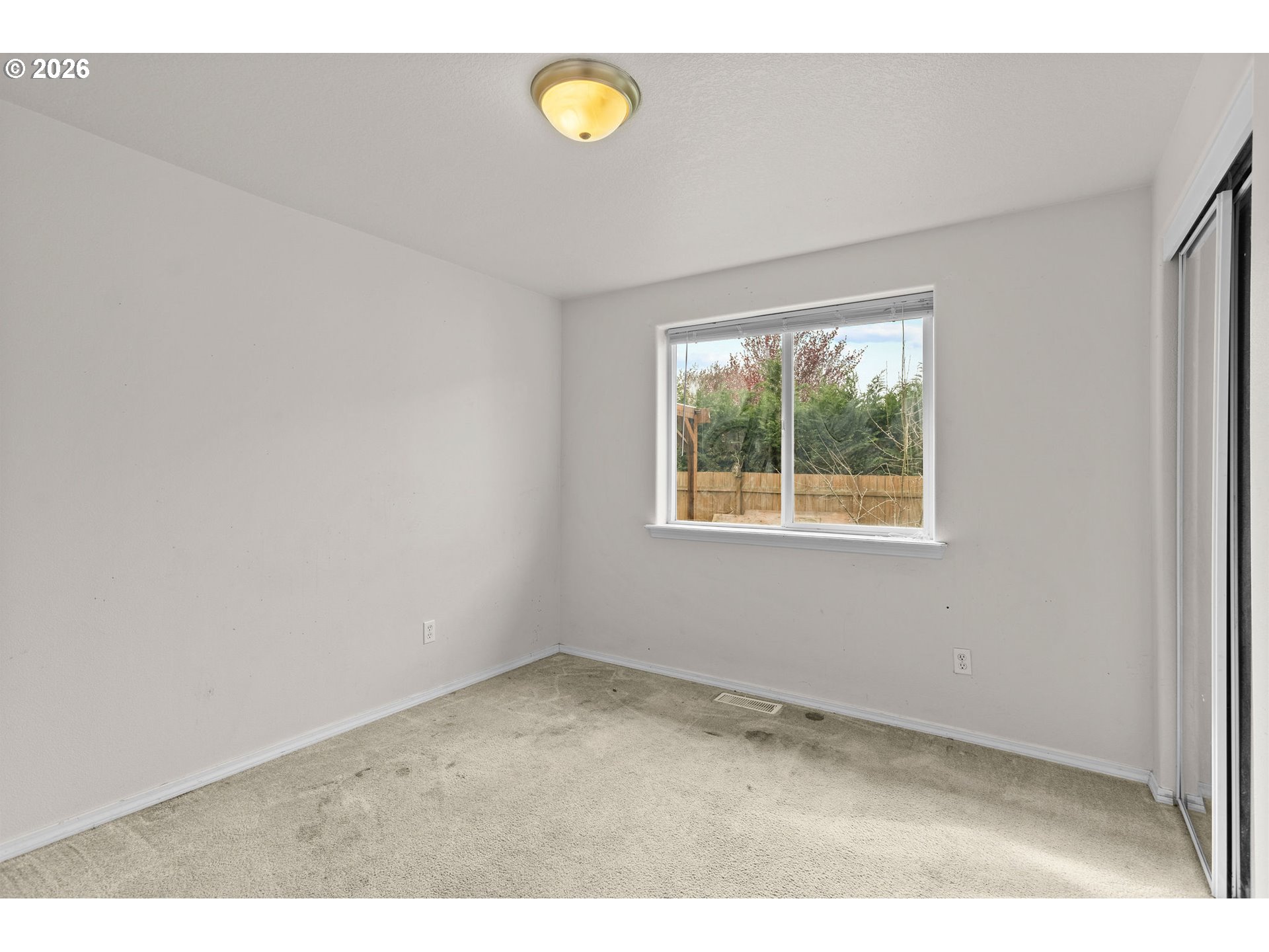 844 Hazel Street Jefferson, OR 97352 - Photo 16 of 22 a view of an empty room with a window
