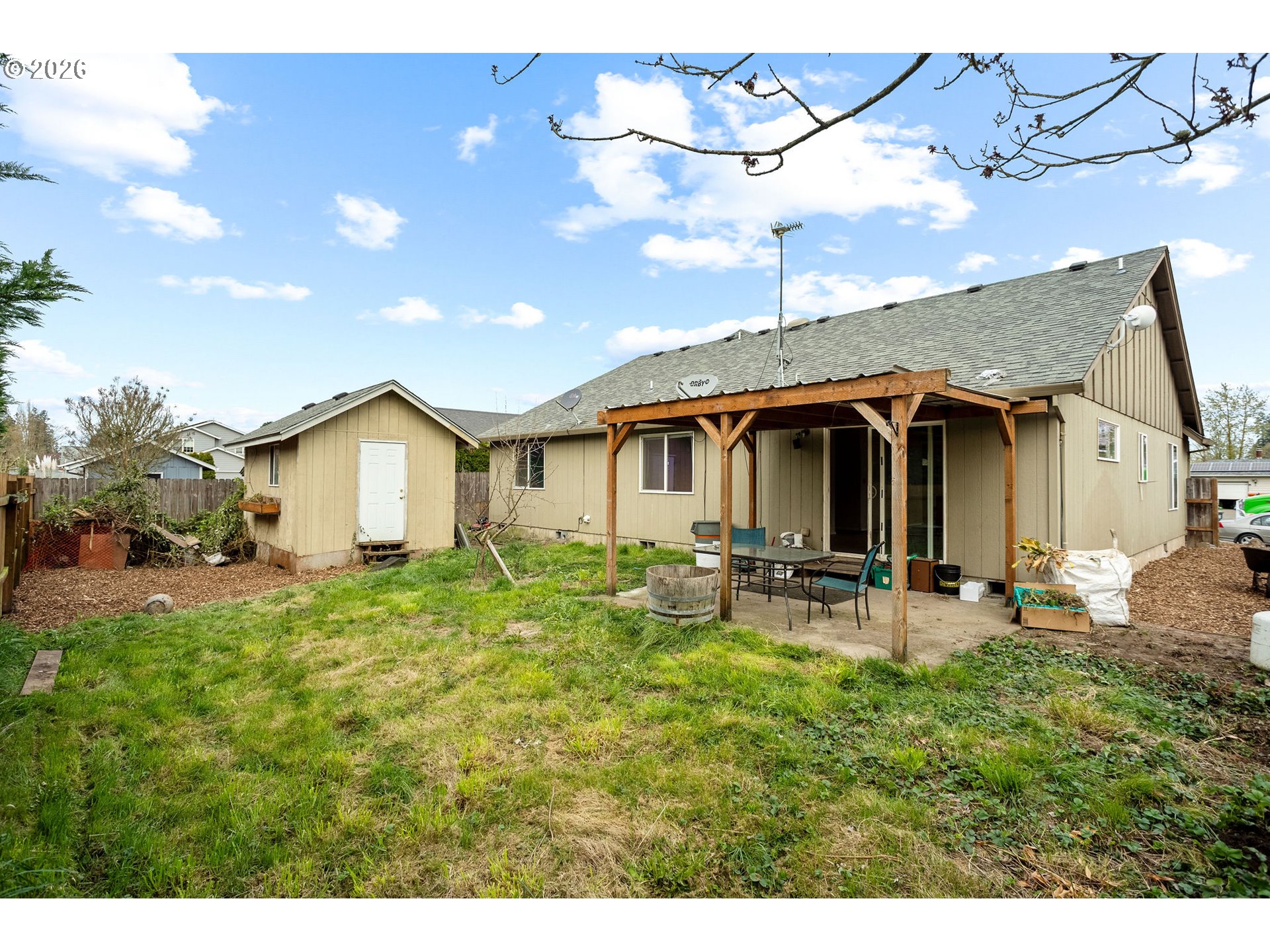 844 Hazel Street Jefferson, OR 97352 - Photo 4 of 22 a view of a house with patio and a yard