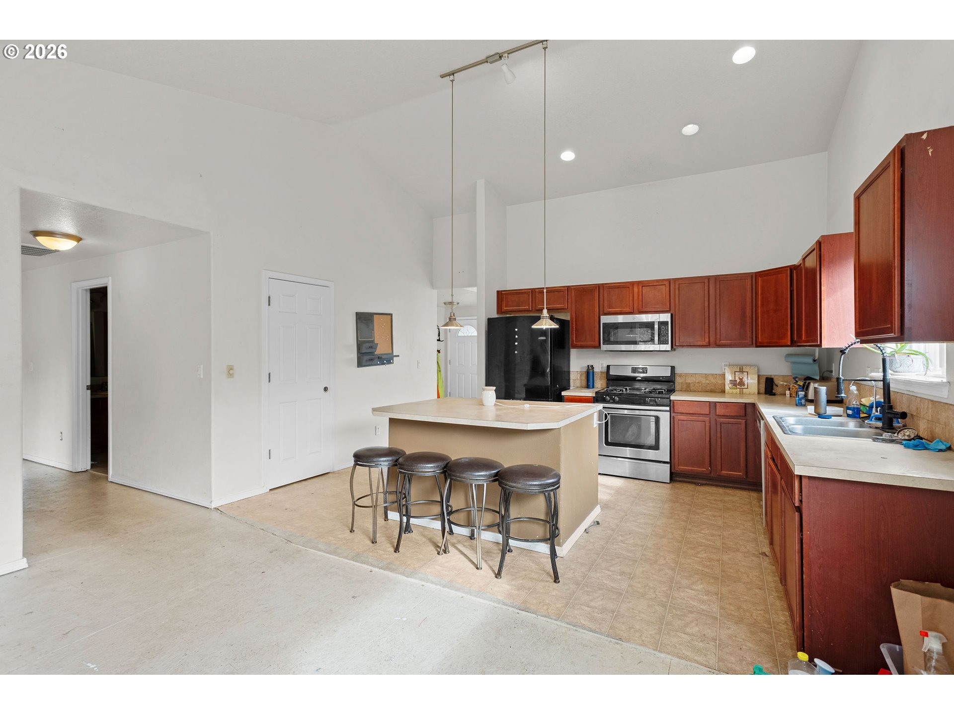 844 Hazel Street Jefferson, OR 97352 - Photo 7 of 22 a kitchen with stainless steel appliances kitchen island granite countertop a sink and cabinets