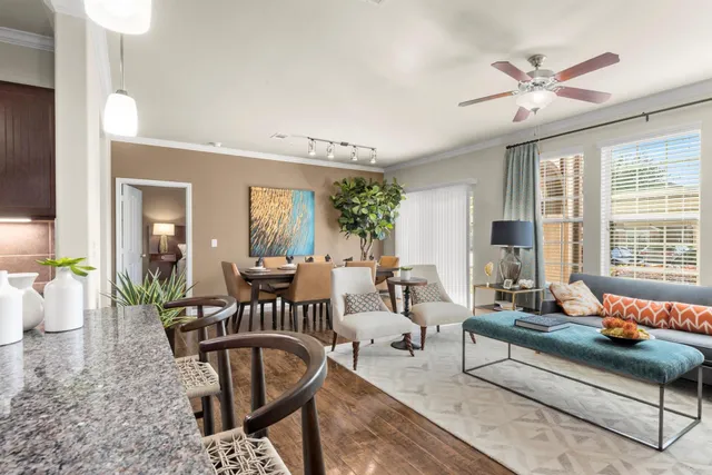 a living room with furniture and a large window