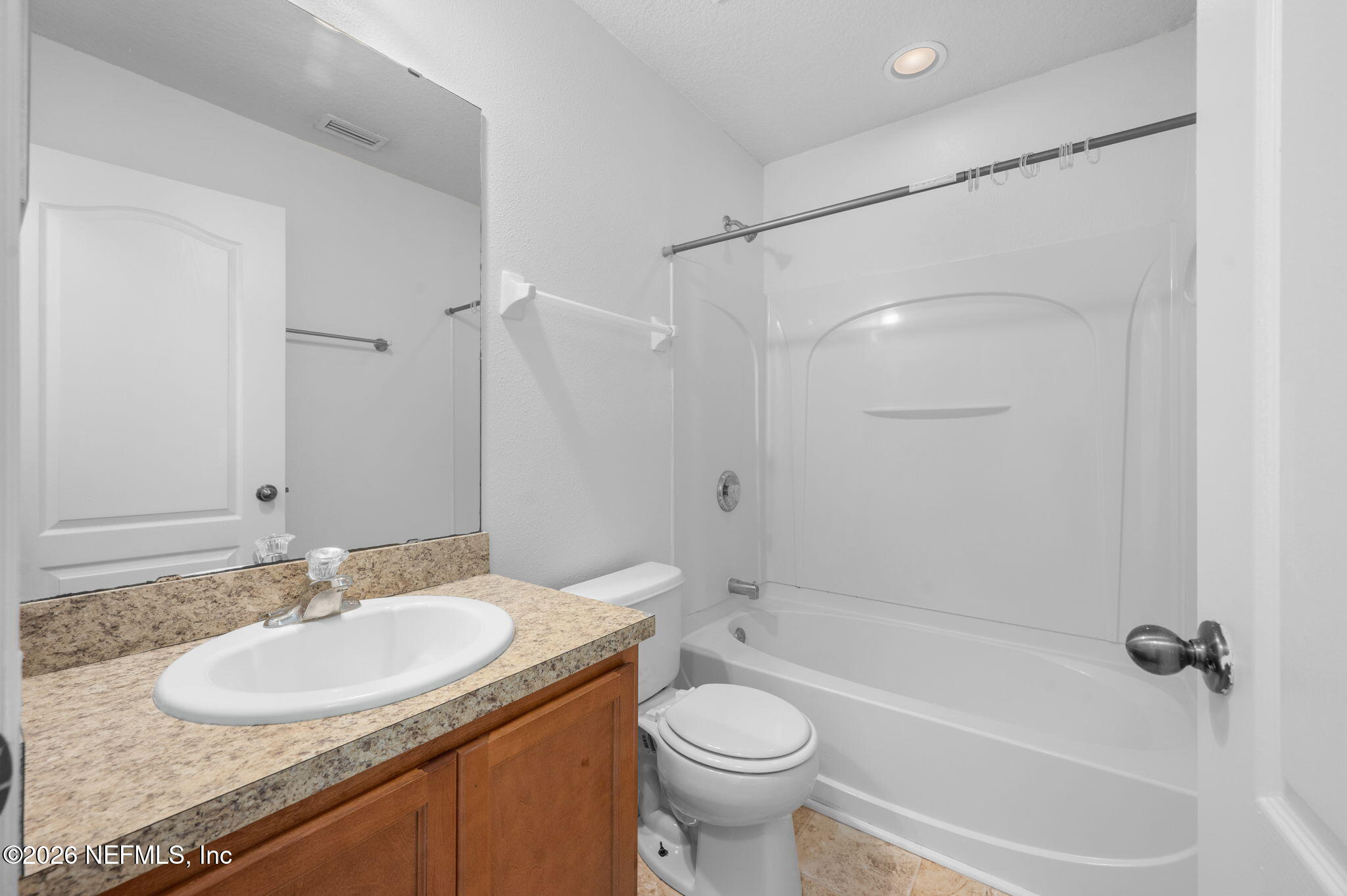253 Syrah Way St. Augustine, FL 32084 - Photo 32 of 39 a bathroom with a granite countertop sink toilet and shower