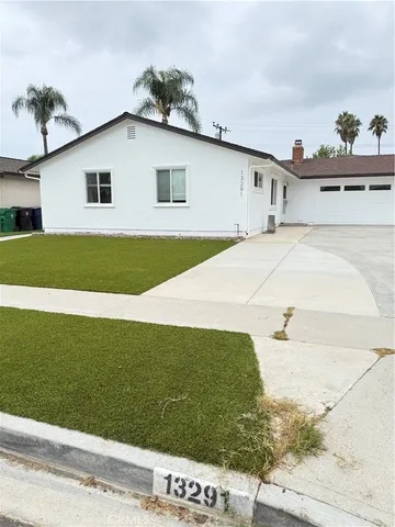 a kitchen with wooden cabinets and a stove top oven