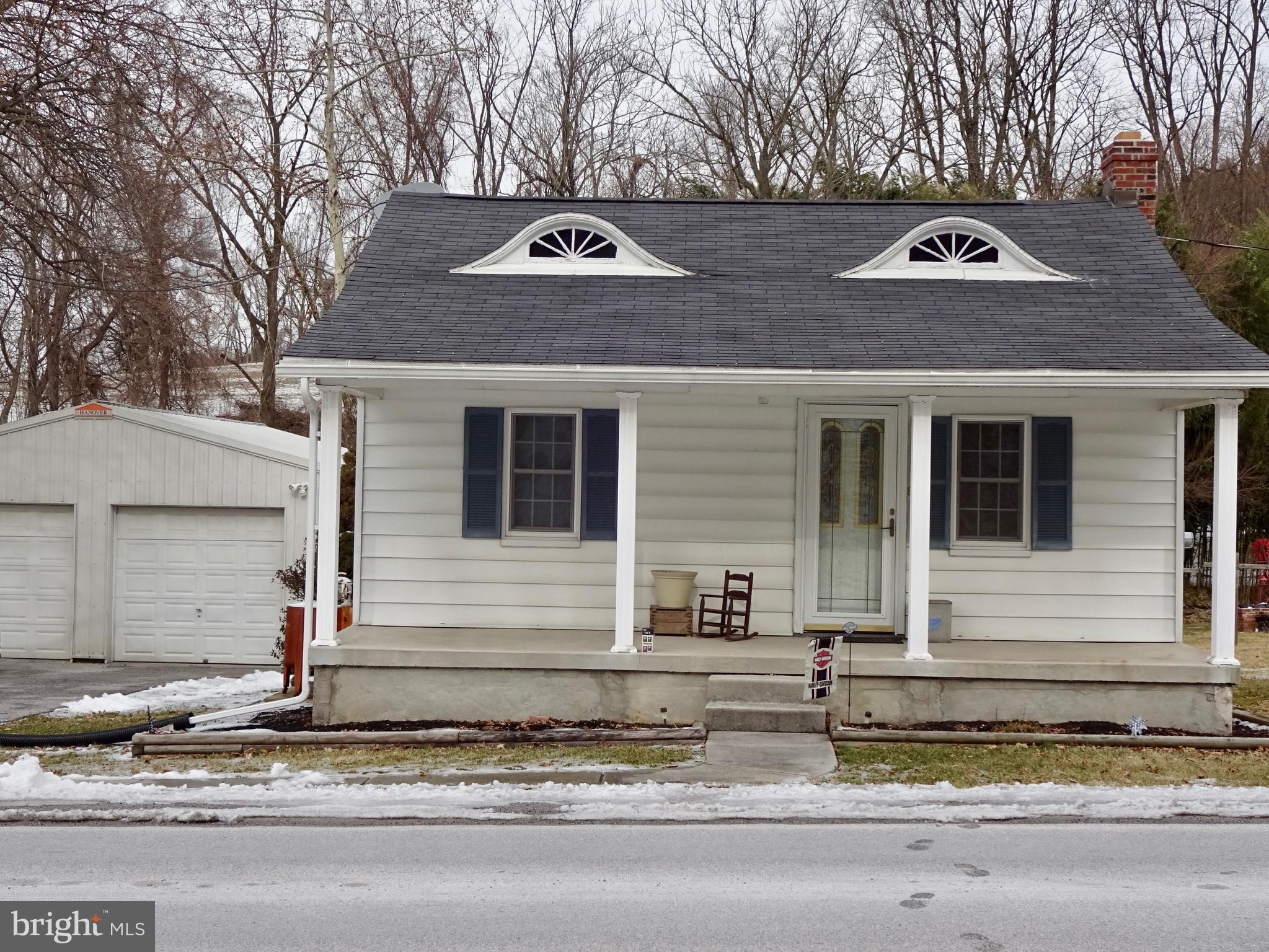 5487 Lehman Road Spring Grove, PA 17362 - Photo 1 of 51 a front view of a house with a garden and trees