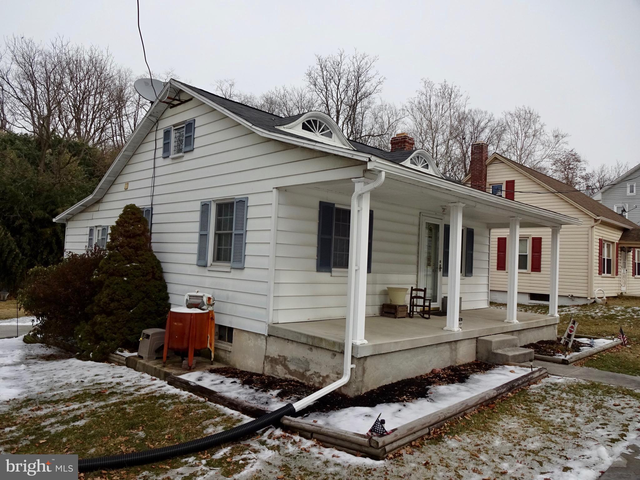 5487 Lehman Road Spring Grove, PA 17362 - Photo 2 of 51 a view of a white house with many windows next to a road