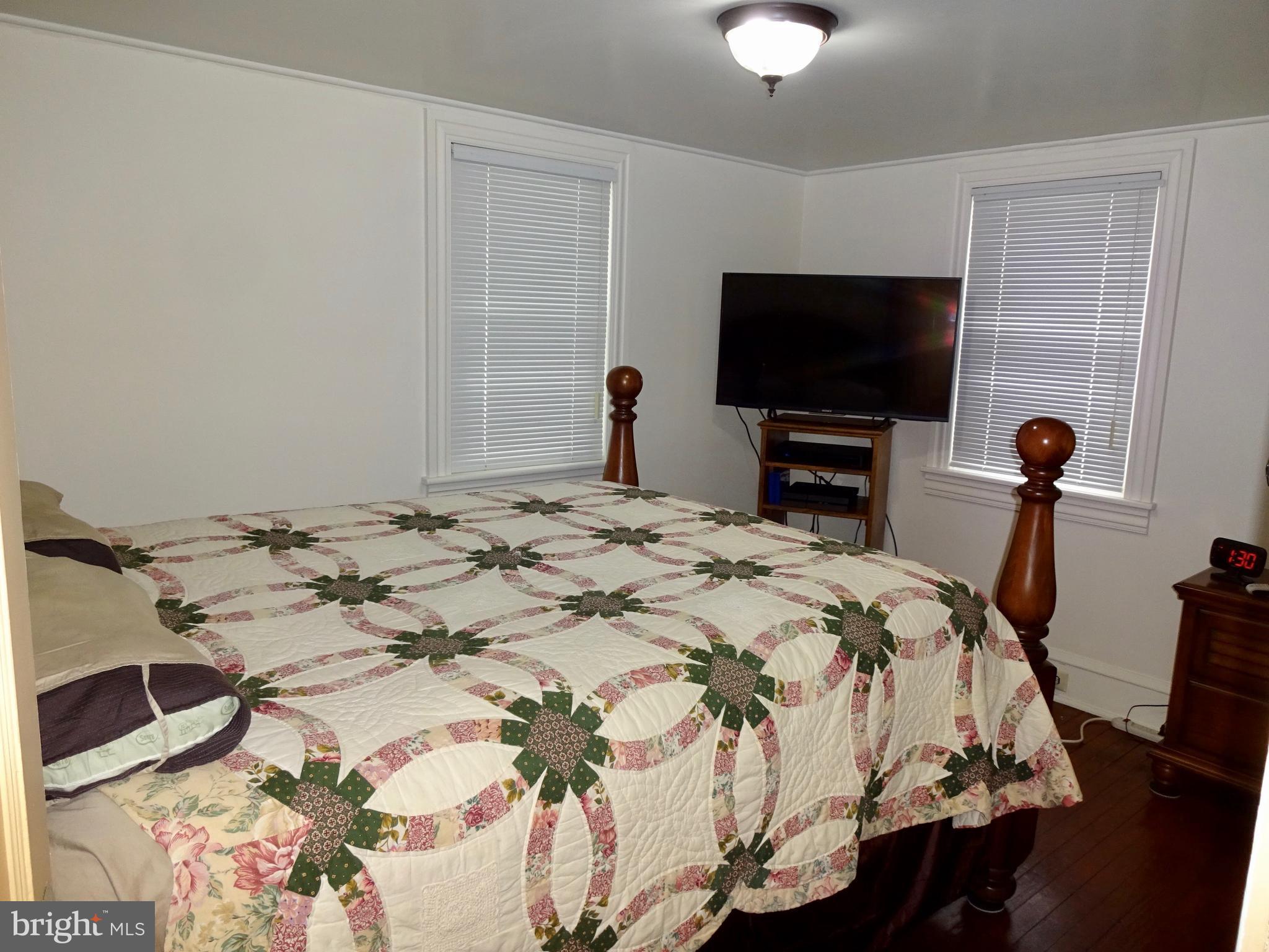 5487 Lehman Road Spring Grove, PA 17362 - Photo 21 of 51 a bedroom with a bed and a flat screen tv