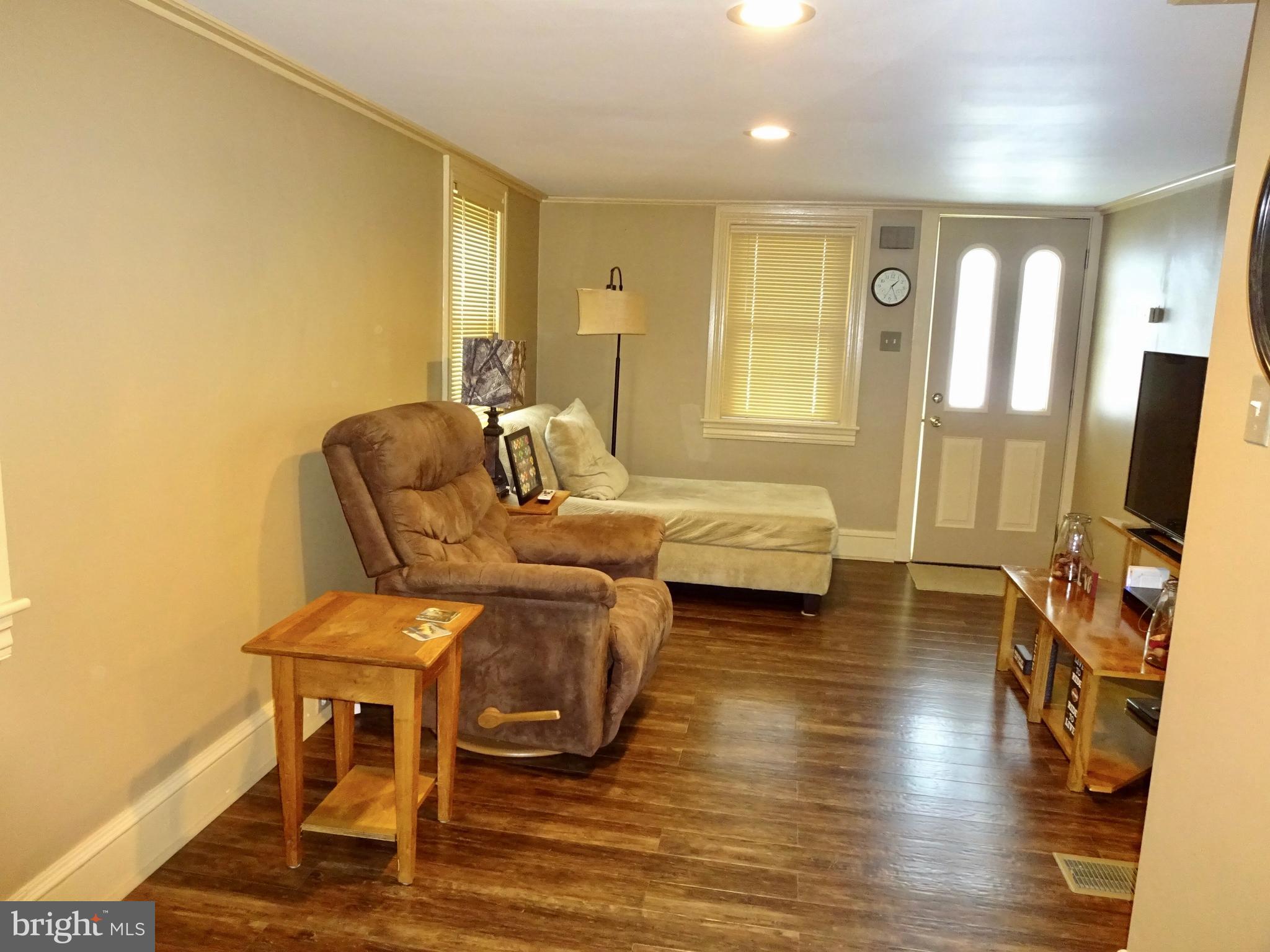 5487 Lehman Road Spring Grove, PA 17362 - Photo 8 of 51 a living room with furniture and a flat screen tv