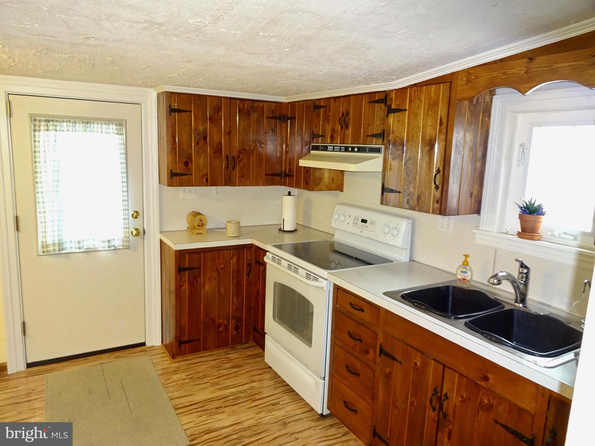 5487 Lehman Road Spring Grove, PA 17362 - Photo 10 of 51 a kitchen with stainless steel appliances a sink a stove and a refrigerator