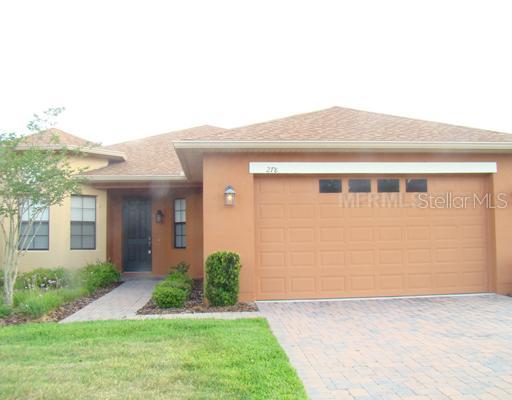 278 Scripps Ranch Road Kissimmee, FL 34759 - Photo 1 of 1 a front view of a house with garden