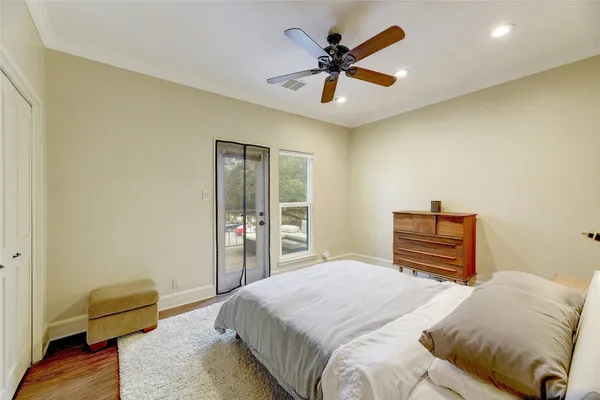 a bedroom with a bed and a couch