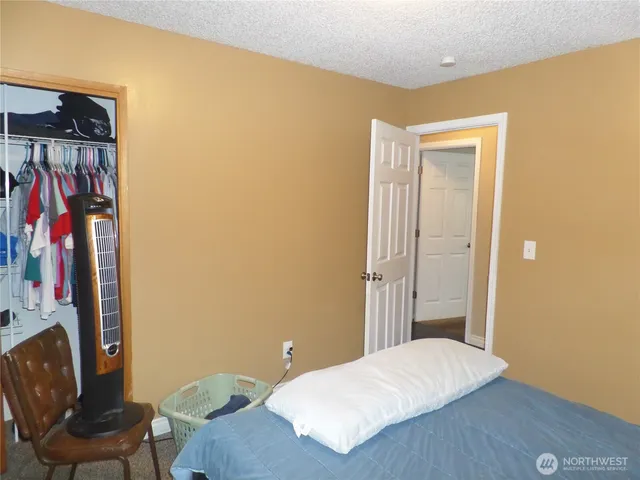 a bedroom with a bed and furniture