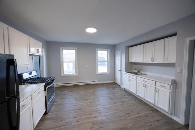 a view of a kitchen with electric appliances