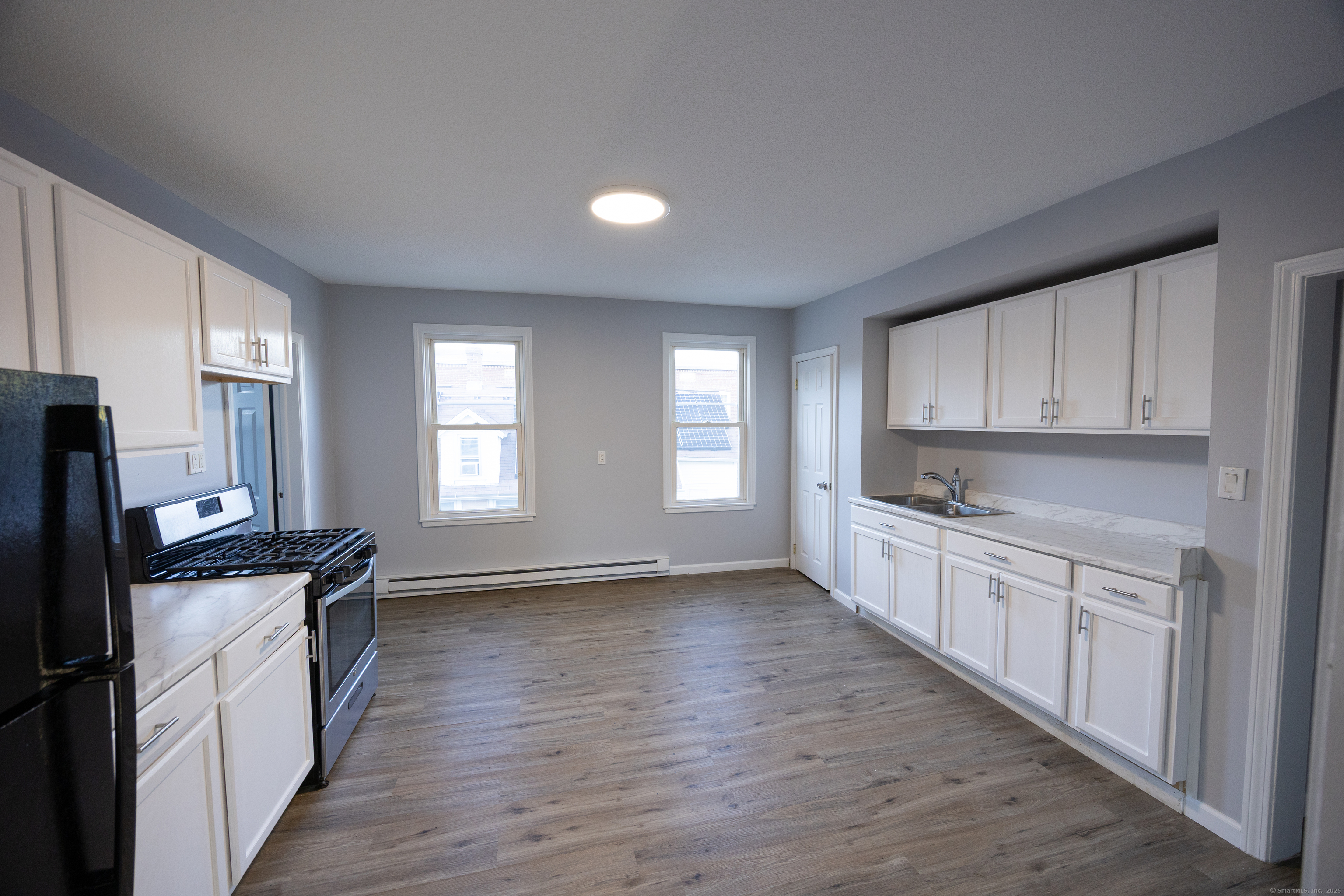 127 Lawlor Street New Britain, CT 06051 - Photo 4 of 9 a view of a kitchen with electric appliances