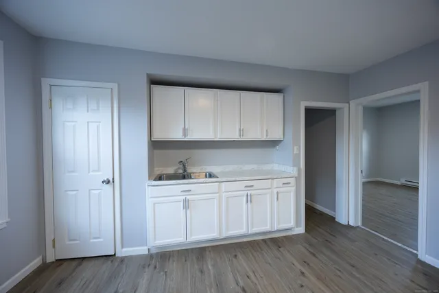 a view of cabinets and wooden floor