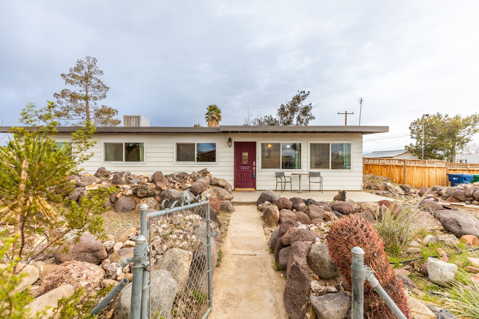 1263 South Primrose Street Ridgecrest, CA 93555 - Photo 2 of 36 a view of a house with swimming pool and sitting area