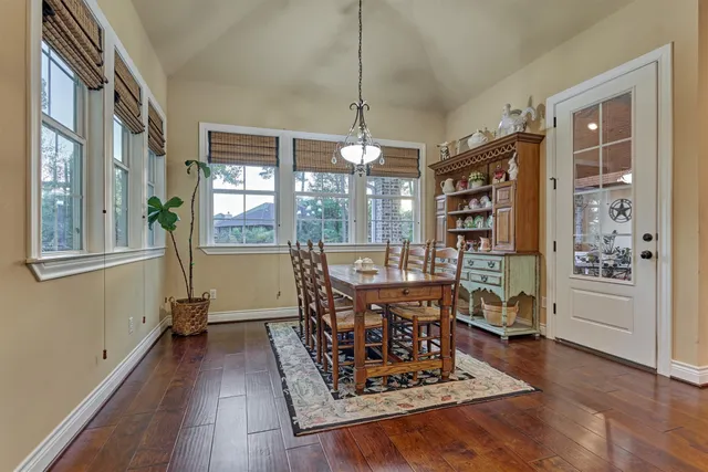 a spacious bathroom with a granite countertop sink and a mirror