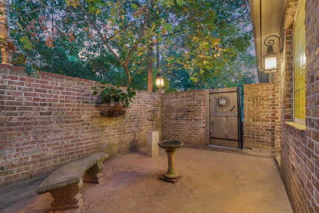 a spacious bedroom with a bed and a chandelier