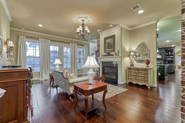 a kitchen with stainless steel appliances granite countertop a stove and a wooden cabinets