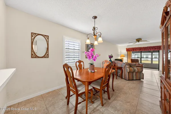 a dining room with furniture and window