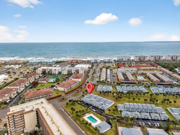 an aerial view of beach and ocean