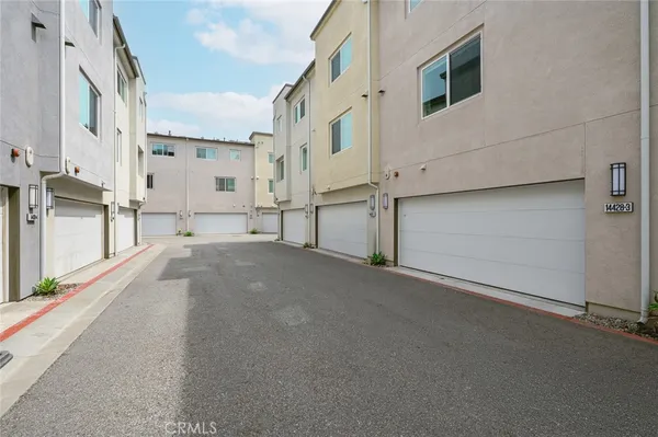 a view of a street with parking