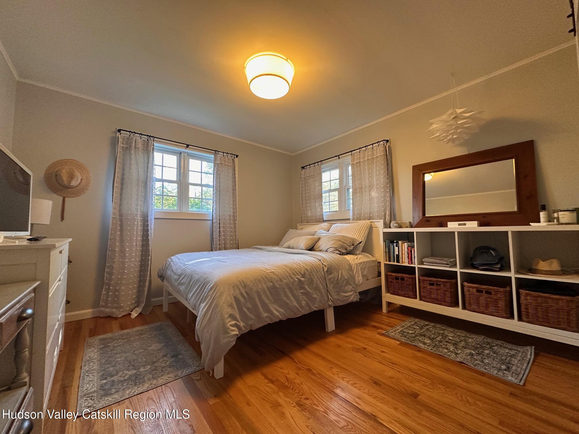 49 George Saile Road Saugerties, NY 12477 - Photo 12 of 23 a bedroom with a bed and a flat tv screen on the dresser