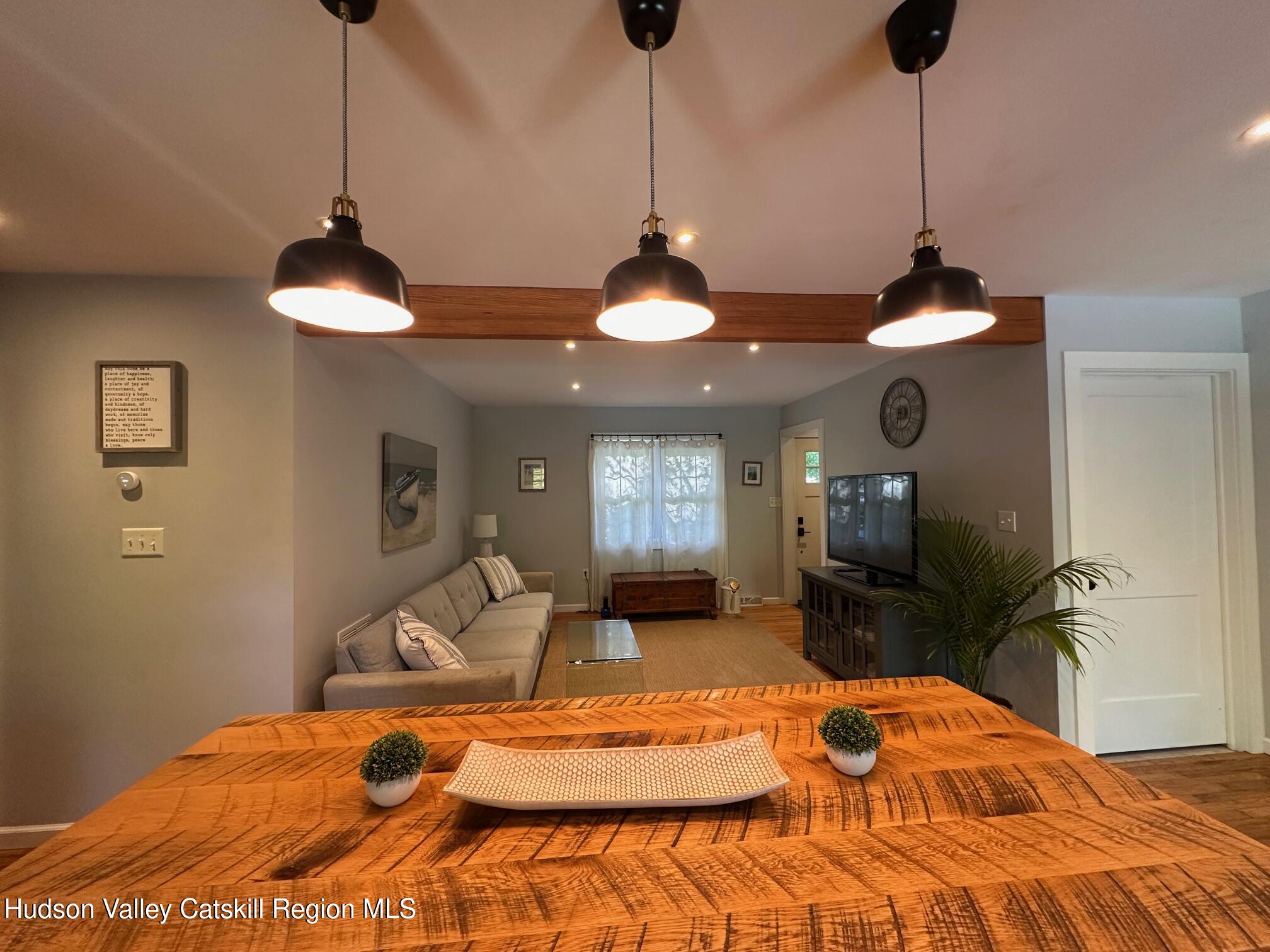 49 George Saile Road Saugerties, NY 12477 - Photo 8 of 23 a bedroom with a bed and a chandelier