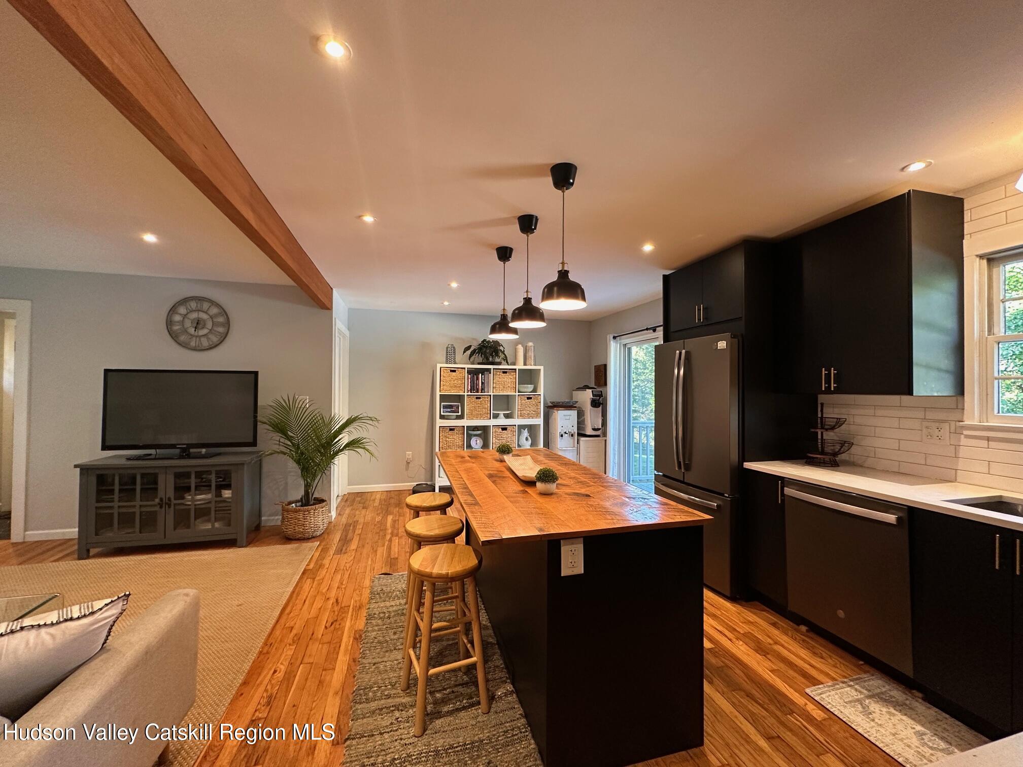 49 George Saile Road Saugerties, NY 12477 - Photo 10 of 23 a dining hall with stainless steel appliances kitchen island granite countertop a refrigerator and a stove top oven
