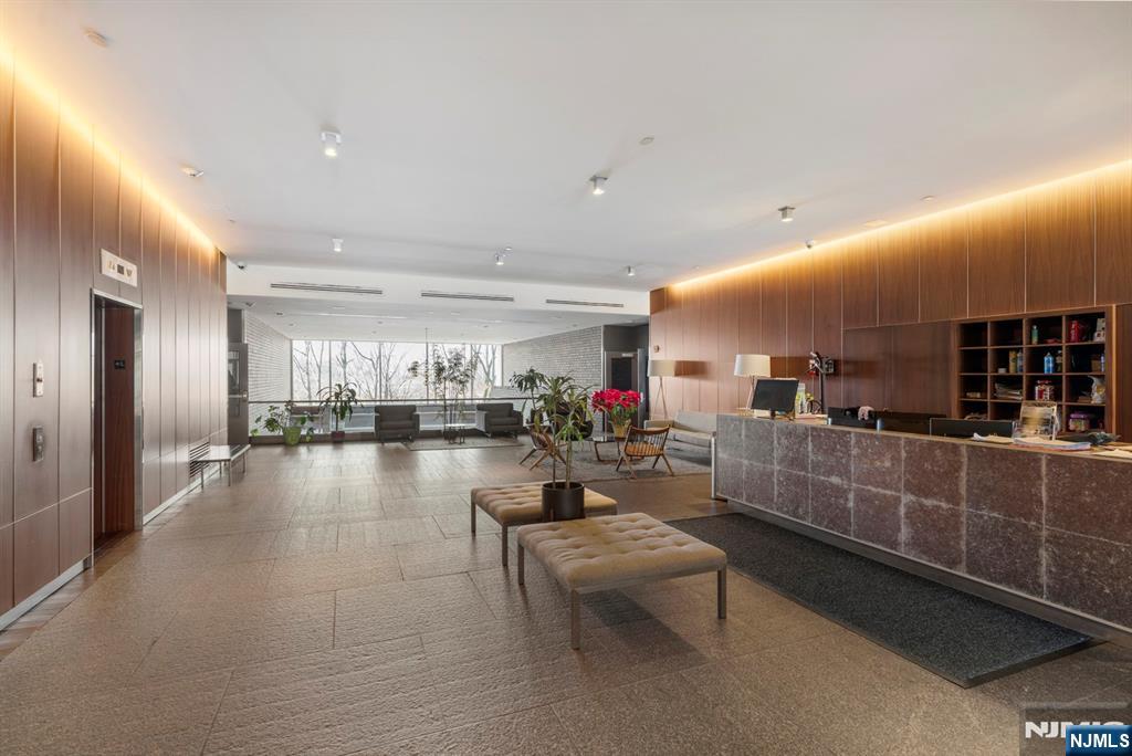1 Executive Drive, Unit 201 Fort Lee, NJ 07024 - Photo 3 of 7 a lobby with furniture and lots of counter space