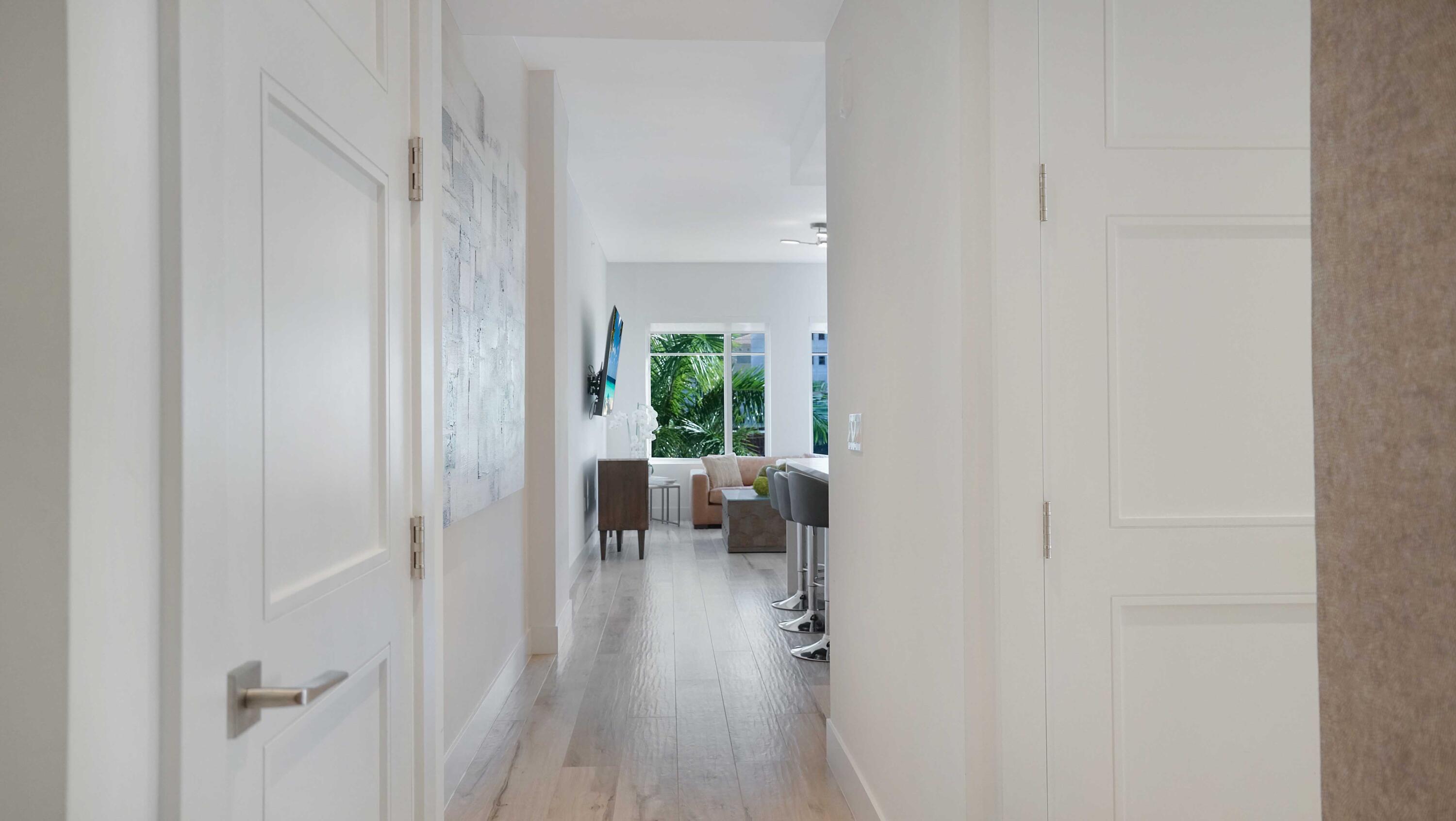 155 East Boca Raton Road, Unit 301 Boca Raton, FL 33432 - Photo 24 of 60 a view of a bedroom with a hardwood floor
