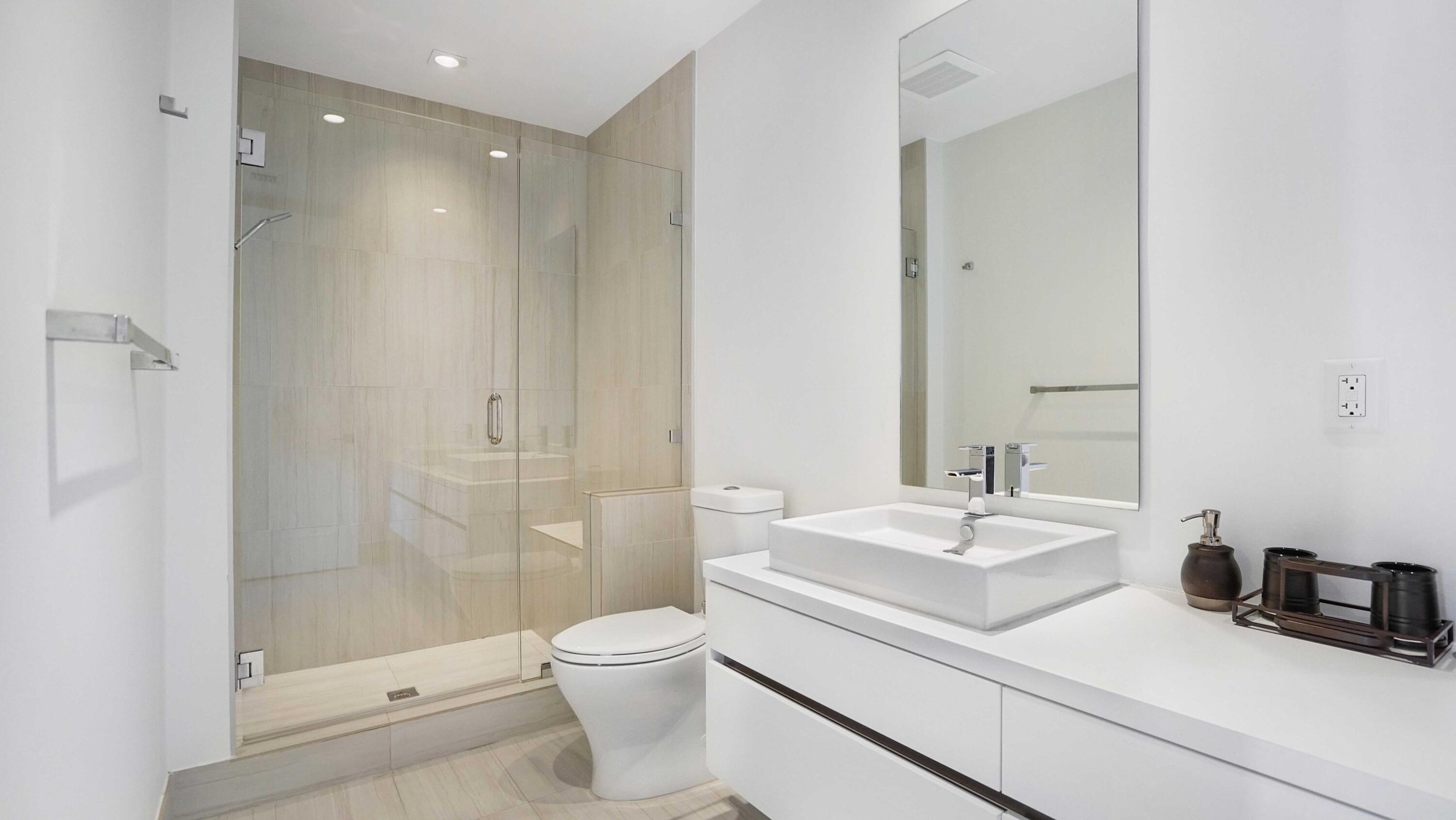 155 East Boca Raton Road, Unit 301 Boca Raton, FL 33432 - Photo 5 of 60 a bathroom with a sink a toilet and shower