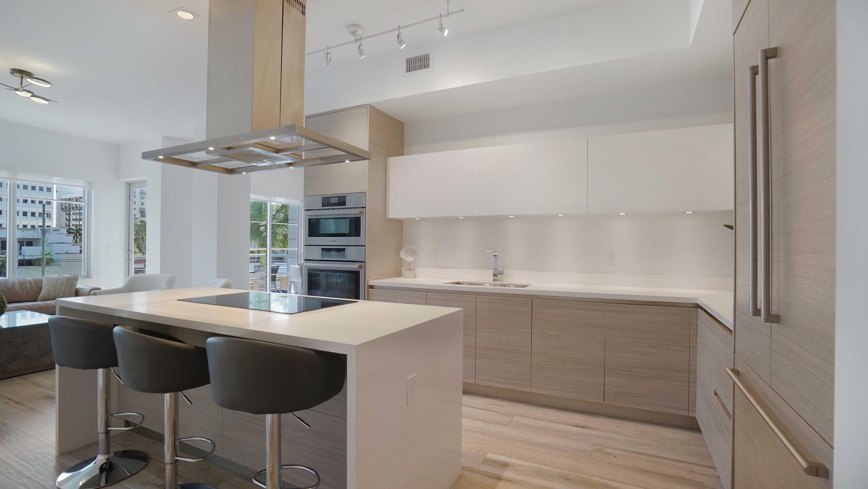 155 East Boca Raton Road, Unit 301 Boca Raton, FL 33432 - Photo 9 of 60 a kitchen with stainless steel appliances granite countertop a sink and a refrigerator