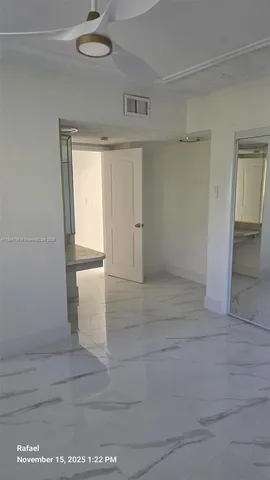 a bathroom with a mirror and a shower