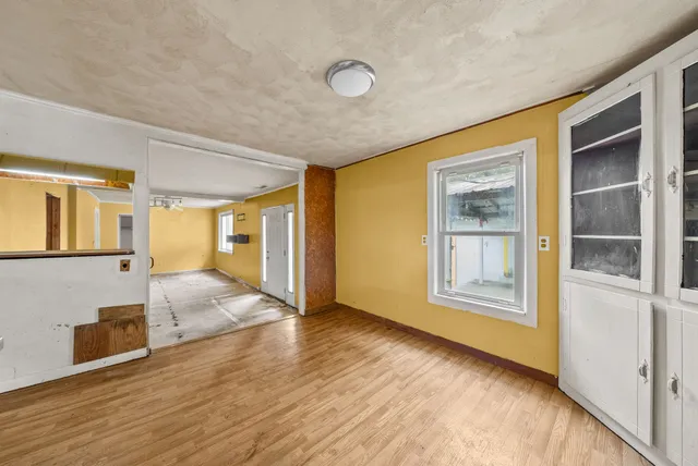a view of livingroom with hardwood floor and hallway