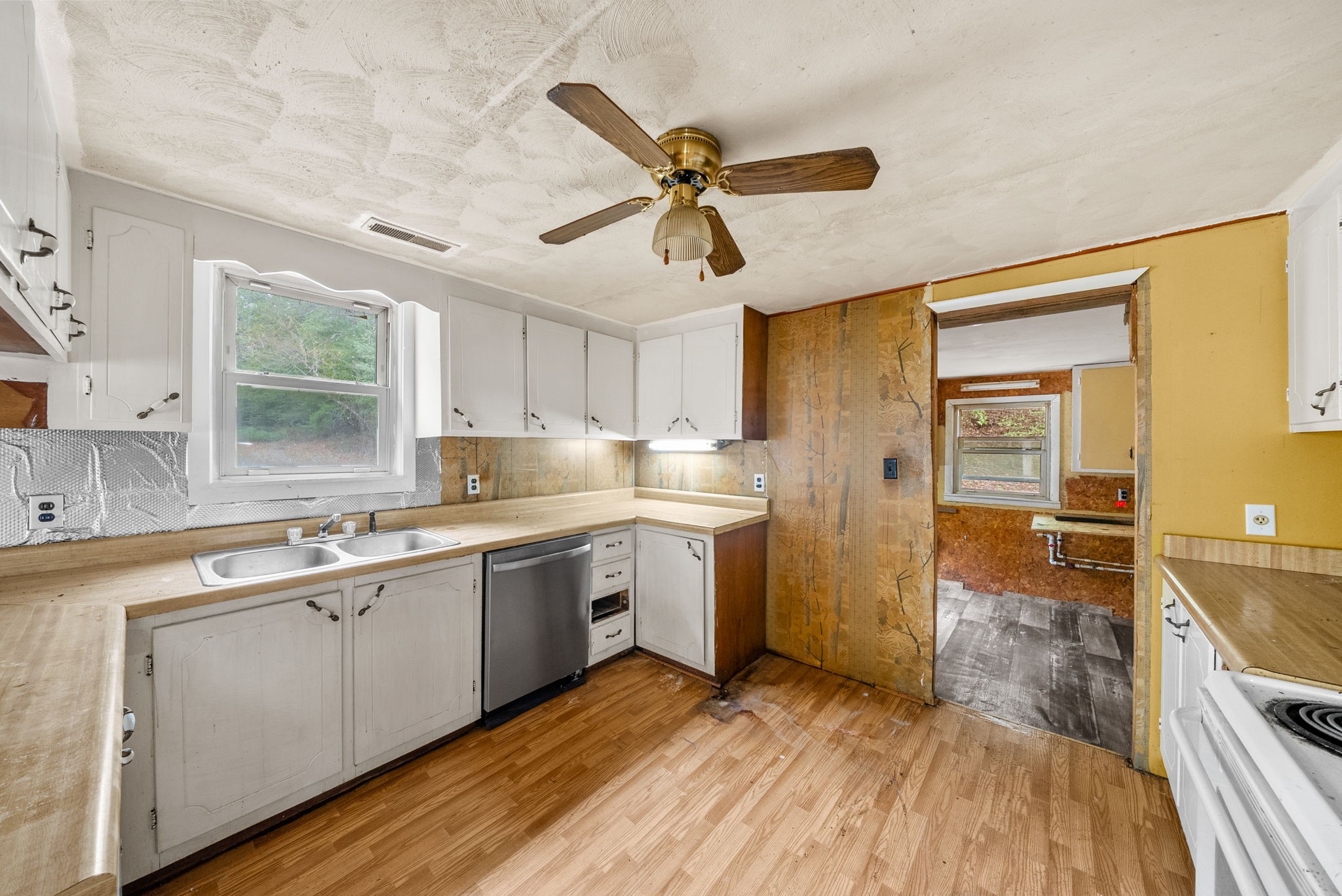 234 Lower Standing Rock Road Dover, TN 37058 - Photo 12 of 41 a kitchen with a sink cabinets and window