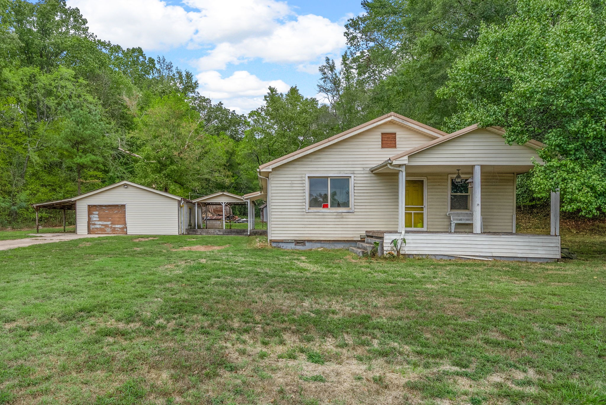 234 Lower Standing Rock Road Dover, TN 37058 - Photo 2 of 41 a front view of a house with yard and green space