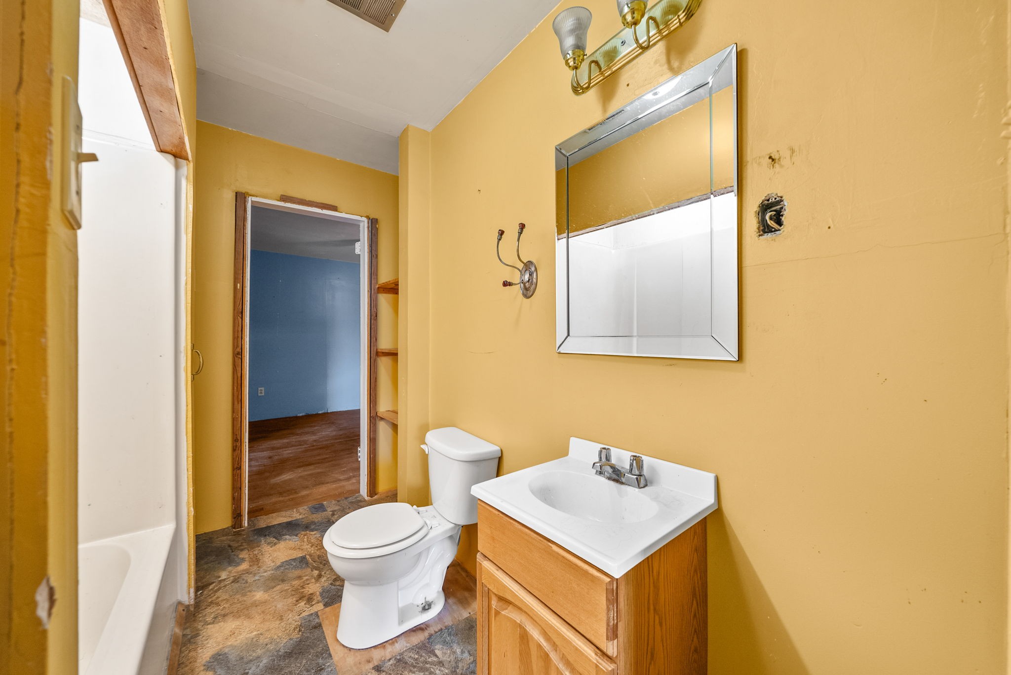 234 Lower Standing Rock Road Dover, TN 37058 - Photo 25 of 41 a bathroom with a toilet sink vanity and mirror