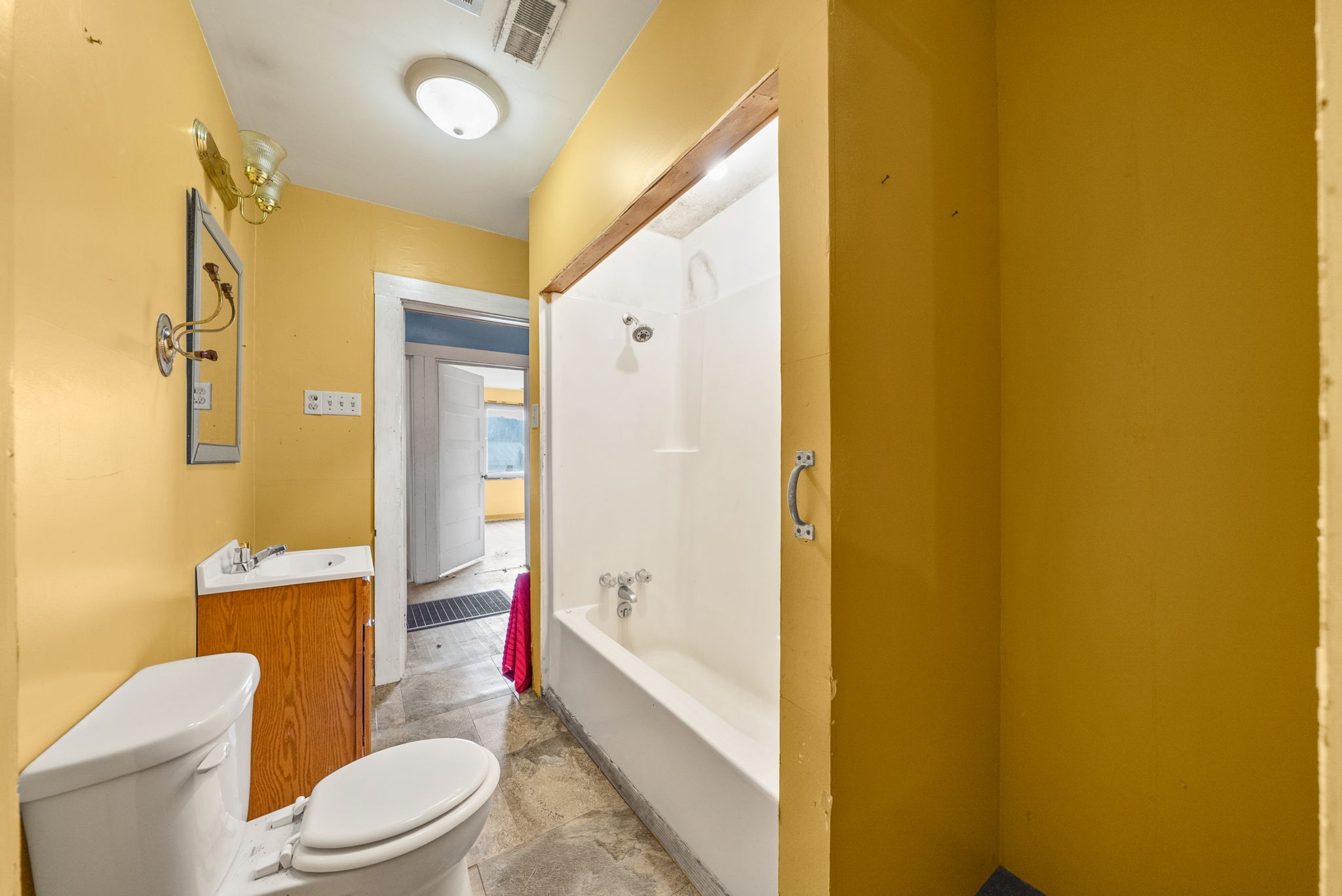 234 Lower Standing Rock Road Dover, TN 37058 - Photo 26 of 41 a bathroom with a toilet sink and shower