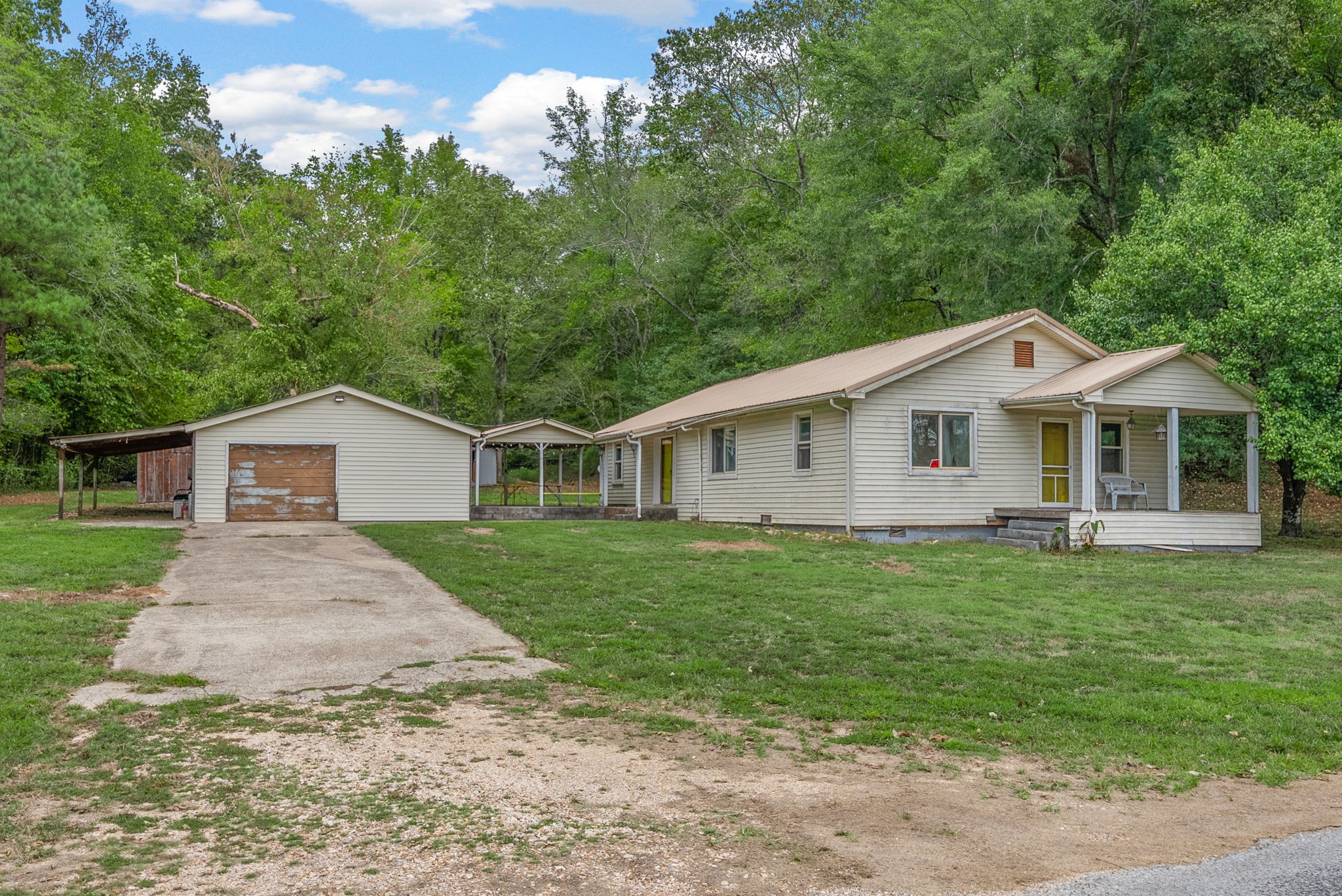 234 Lower Standing Rock Road Dover, TN 37058 - Photo 3 of 41 a front view of a house with a garden