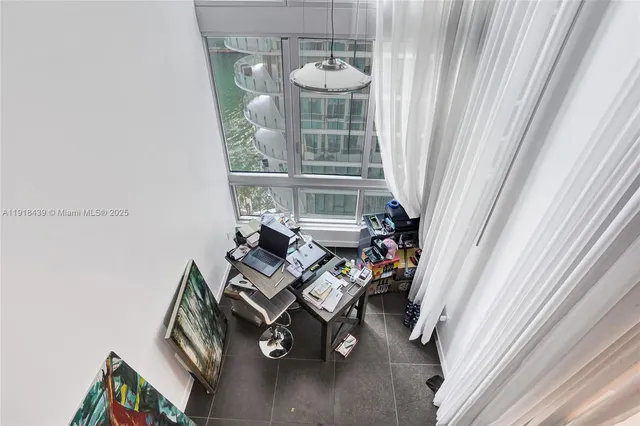 a view of living room with furniture and a fireplace
