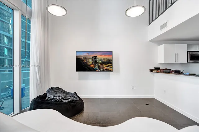 a bathroom with a toilet a sink and a mirror