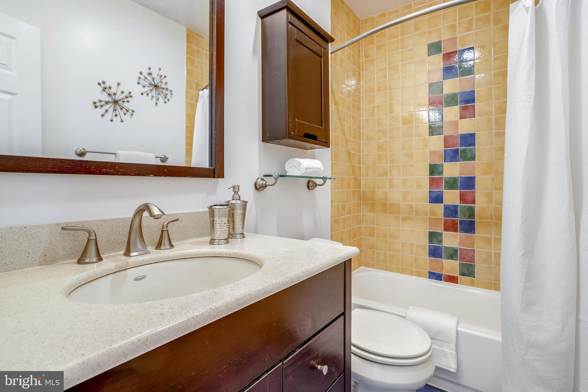 718 F Street Northeast Washington, DC 20002 - Photo 15 of 41 Mediterranean-style tiled Full bath upstairs.
