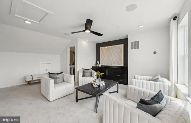 a view of a dining room with furniture wooden floor and a chandelier
